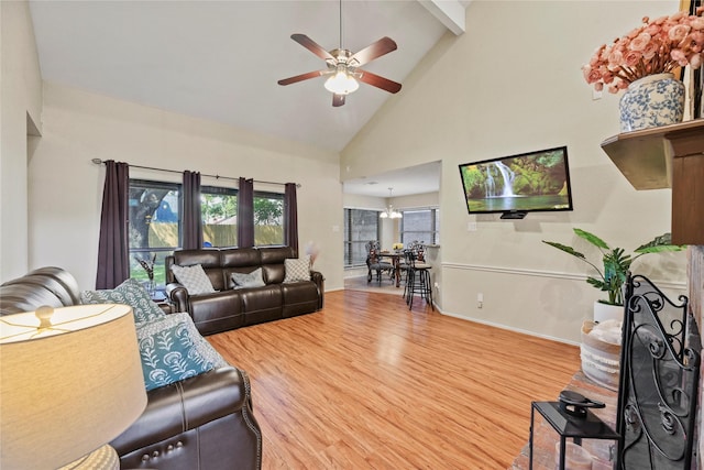 16310 Leamington Ln, Houston, TX 77095 - living room with high vaulted ceiling, a ceiling fan, wood finished floors, beamed ceiling, and baseboards