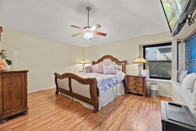 16310 Leamington Ln, Houston, TX 77095 - bedroom featuring light wood-style floors, baseboards, ceiling fan, and vaulted ceiling