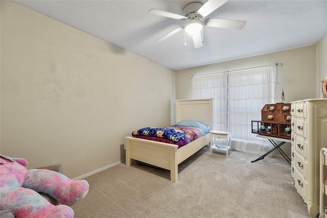 16310 Leamington Ln, Houston, TX 77095 - carpeted bedroom with a ceiling fan and baseboards