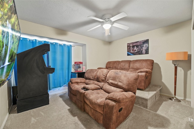 16310 Leamington Ln, Houston, TX 77095 - living room featuring carpet, ceiling fan, baseboards, and a textured ceiling