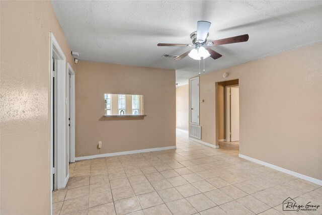 719 Kilpatrick St, Channelview, TX 77530 - spare room featuring a ceiling fan, light tile patterned floors, and a textured ceiling