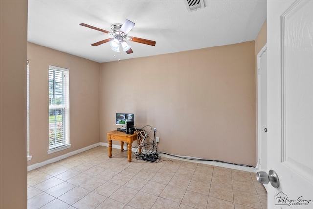 719 Kilpatrick St, Channelview, TX 77530 - unfurnished office with ceiling fan, light tile patterned flooring, and baseboards