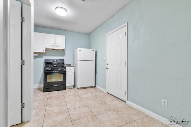 719 Kilpatrick St, Channelview, TX 77530 - kitchen featuring freestanding refrigerator, black gas stove, under cabinet range hood, white cabinets, and baseboards