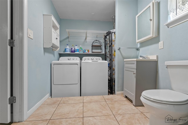719 Kilpatrick St, Channelview, TX 77530 - washroom featuring separate washer and dryer, tile patterned floors, and baseboards