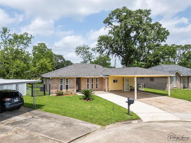 719 Kilpatrick St, Channelview, TX 77530 - single story home featuring concrete driveway, brick siding, and a carport