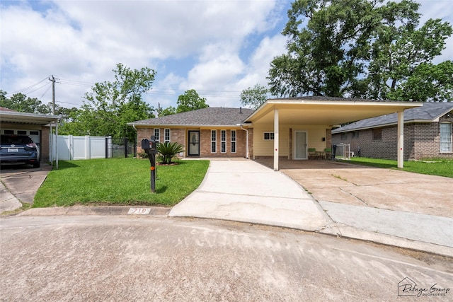 719 Kilpatrick St, Channelview, TX 77530 - ranch-style home with brick siding, concrete driveway, and a carport