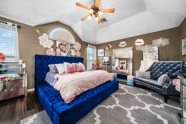 25993 Royal Emerald Ln, Kingwood, TX 77339 - bedroom featuring wood finished floors, multiple windows, vaulted ceiling, ceiling fan, and baseboards