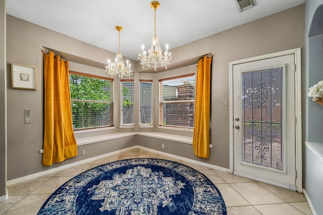 25993 Royal Emerald Ln, Kingwood, TX 77339 - tiled entrance foyer with a chandelier, healthy amount of natural light, and baseboards
