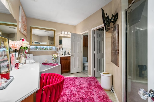 25993 Royal Emerald Ln, Kingwood, TX 77339 - bathroom featuring vanity, toilet, a shower stall, and tile patterned flooring