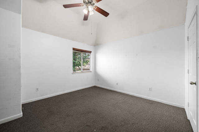 25993 Royal Emerald Ln, Kingwood, TX 77339 - empty room with dark carpet, a ceiling fan, vaulted ceiling, and baseboards