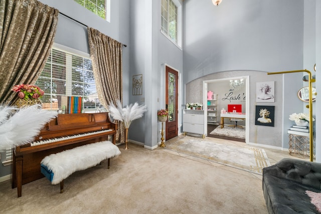 25993 Royal Emerald Ln, Kingwood, TX 77339 - entryway featuring a high ceiling, carpet, and baseboards