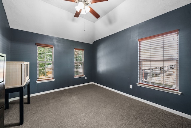 25993 Royal Emerald Ln, Kingwood, TX 77339 - unfurnished office with vaulted ceiling, a ceiling fan, carpet flooring, and baseboards