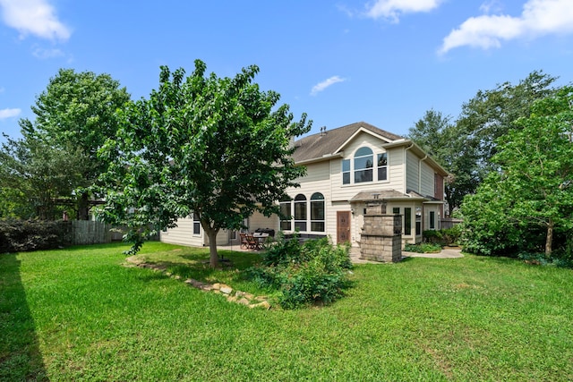 25993 Royal Emerald Ln, Kingwood, TX 77339 - rear view of house with a patio