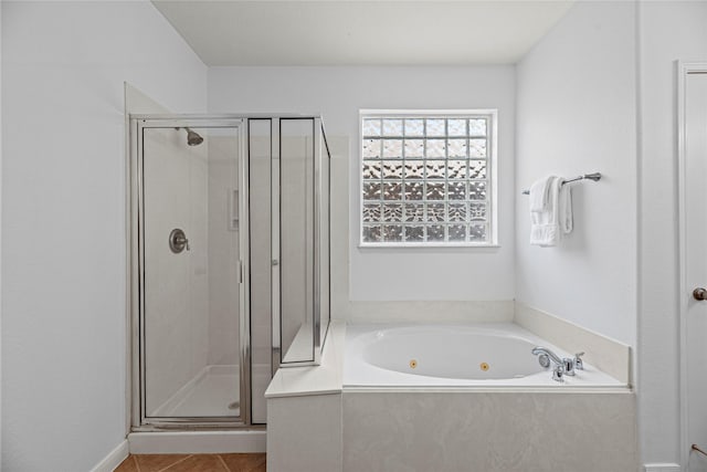 10307 Antelope Aly, Missouri City, TX 77459 - bathroom featuring a shower stall, a tub with jets, and tile patterned flooring