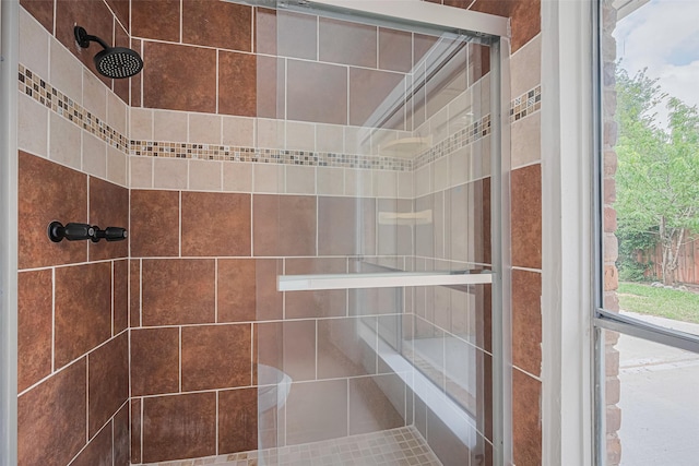 full bathroom with a tile shower