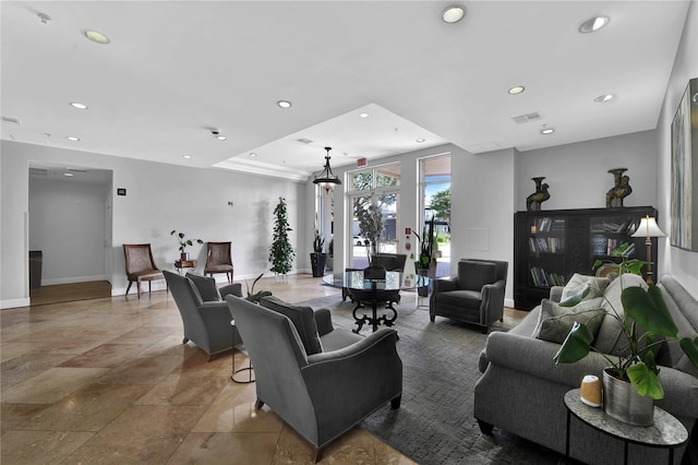 2520 Robinhood St Unit 1205, Houston, TX 77005 - living room featuring baseboards, recessed lighting, and stone tile floors