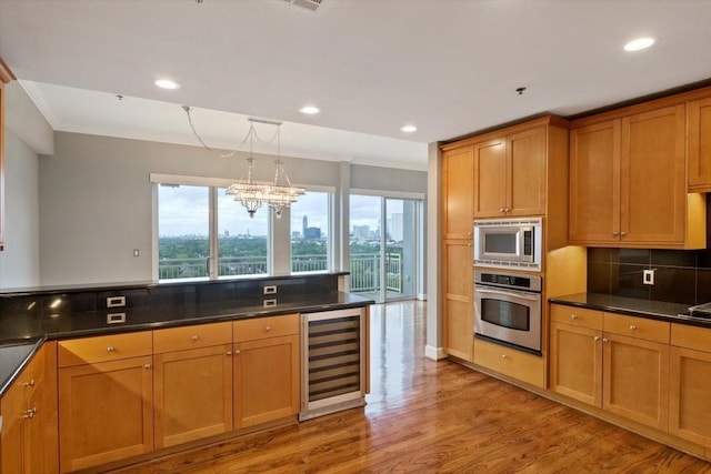 2520 Robinhood St Unit 1205, Houston, TX 77005 - kitchen with appliances with stainless steel finishes, wine cooler, decorative backsplash, dark countertops, and light wood-style flooring