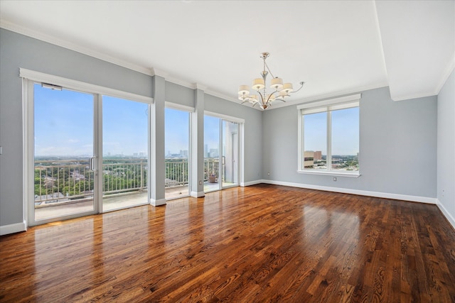 2520 Robinhood St Unit 1205, Houston, TX 77005 - unfurnished room with a chandelier, crown molding, plenty of natural light, baseboards, and wood finished floors