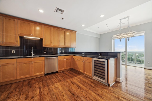2520 Robinhood St Unit 1205, Houston, TX 77005 - kitchen featuring dishwasher, wine cooler, a sink, crown molding, and tasteful backsplash
