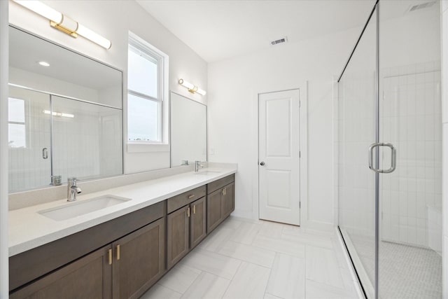 1650 W Tidwell Rd, Houston, TX 77091 - bathroom with a stall shower and double vanity