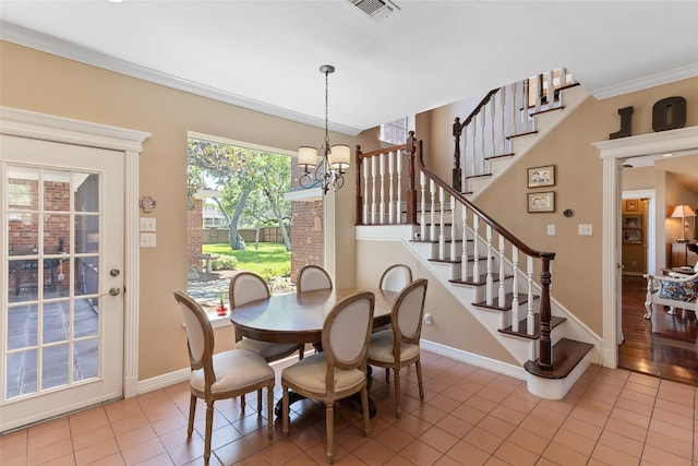 51 Oak Hollow Cir, Lake Jackson, TX 77566 - dining room with a chandelier, light tile patterned floors, stairway, baseboards, and crown molding