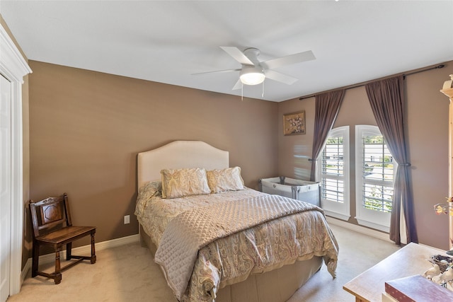 51 Oak Hollow Cir, Lake Jackson, TX 77566 - bedroom with light carpet, a ceiling fan, and baseboards