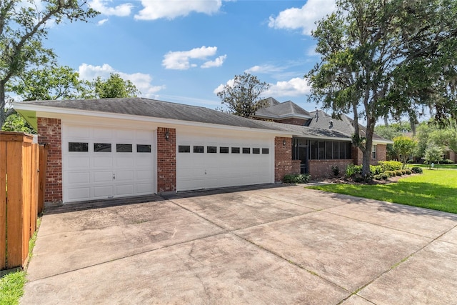 51 Oak Hollow Cir, Lake Jackson, TX 77566 - view of front of house with brick siding, concrete driveway, and an attached garage