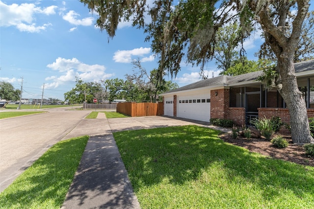 51 Oak Hollow Cir, Lake Jackson, TX 77566 - view of side of property featuring concrete driveway, brick siding, and a garage