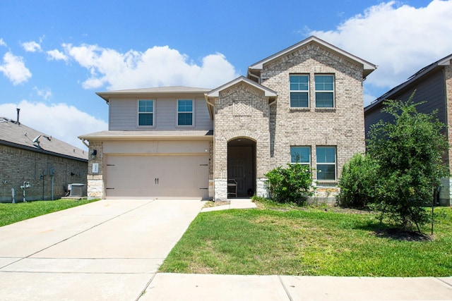 2415 Georgina Falls Dr, Spring, TX 77373 - view of front of house with a garage, a front yard, central air condition unit, stone siding, and driveway