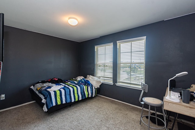 2415 Georgina Falls Dr, Spring, TX 77373 - bedroom with carpet floors and baseboards