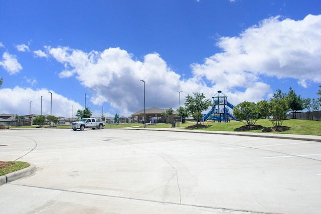2415 Georgina Falls Dr, Spring, TX 77373 - view of road with curbs and street lighting