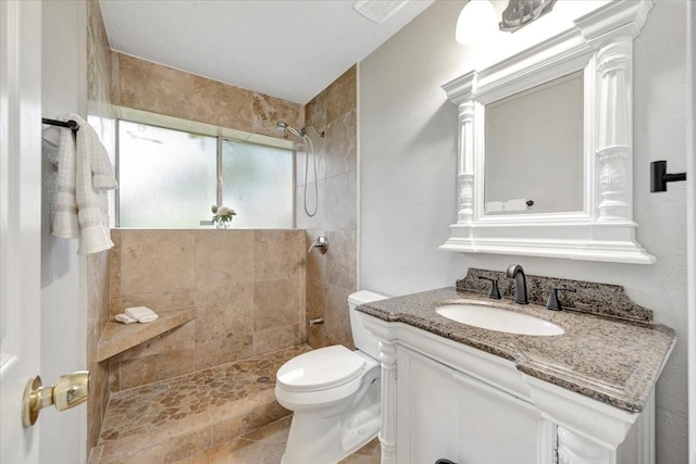 11710 Brettwood Cir, Houston, TX 77089 - full bathroom featuring a tile shower, vanity, and toilet