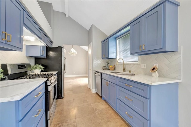 11710 Brettwood Cir, Houston, TX 77089 - kitchen with appliances with stainless steel finishes, blue cabinets, a chandelier, and lofted ceiling