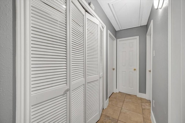 11710 Brettwood Cir, Houston, TX 77089 - hallway featuring attic access, light tile patterned floors, and baseboards