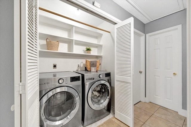 11710 Brettwood Cir, Houston, TX 77089 - laundry area featuring light tile patterned floors and washing machine and clothes dryer