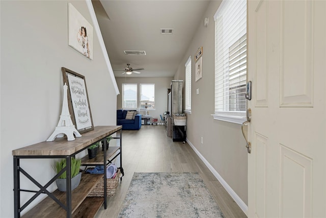 21626 Sage Landing Ln, Katy, TX 77449 - hall featuring light wood finished floors and baseboards