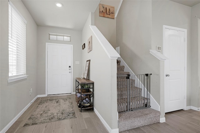 21626 Sage Landing Ln, Katy, TX 77449 - entryway with wood finished floors, stairway, and baseboards