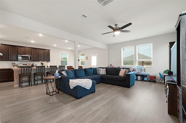 21626 Sage Landing Ln, Katy, TX 77449 - living room featuring healthy amount of natural light, light wood-style flooring, ceiling fan, and recessed lighting