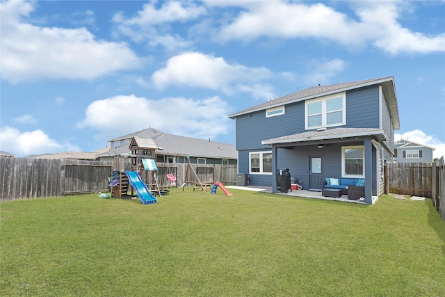 21626 Sage Landing Ln, Katy, TX 77449 - back of house with an outdoor living space, a playground, a patio area, and roof with shingles