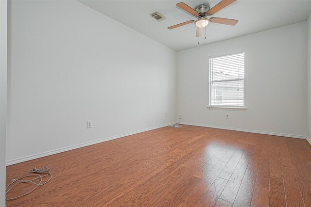 8223 Golf Green Cir, Houston, TX 77036 - unfurnished room featuring wood finished floors, a ceiling fan, baseboards, and vaulted ceiling
