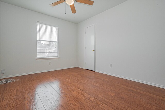 8223 Golf Green Cir, Houston, TX 77036 - unfurnished room featuring wood finished floors, ceiling fan, and baseboards