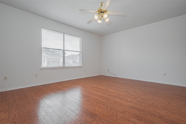 8223 Golf Green Cir, Houston, TX 77036 - unfurnished room with wood finished floors, ceiling fan, and baseboards