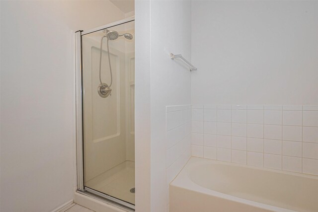 8223 Golf Green Cir, Houston, TX 77036 - bathroom featuring a shower stall and a garden tub