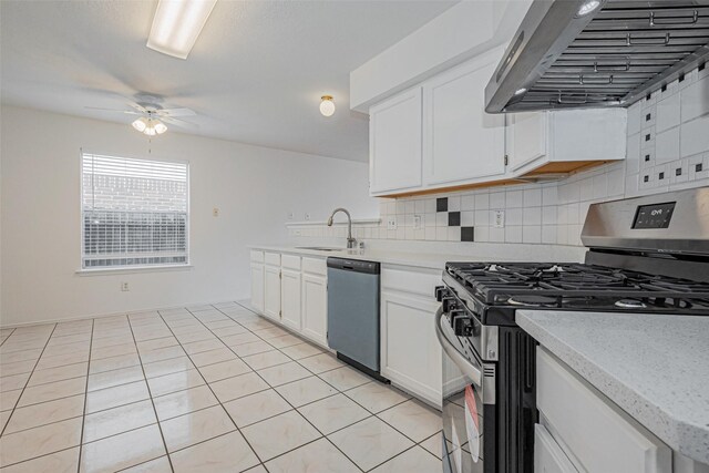 8223 Golf Green Cir, Houston, TX 77036 - kitchen featuring dishwashing machine, stainless steel gas stove, range hood, a sink, and ceiling fan