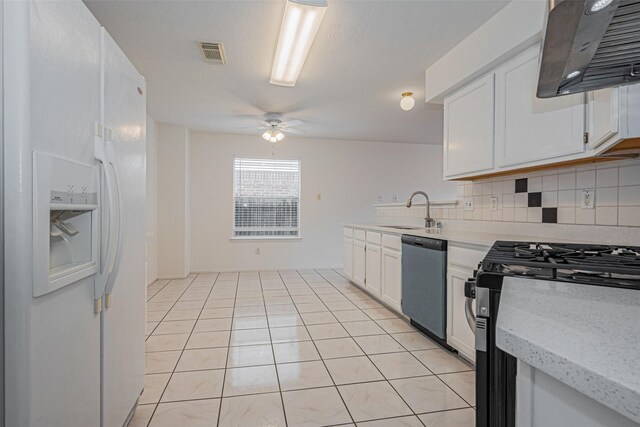 8223 Golf Green Cir, Houston, TX 77036 - kitchen featuring white refrigerator with ice dispenser, dishwashing machine, stainless steel range with gas stovetop, a sink, and extractor fan