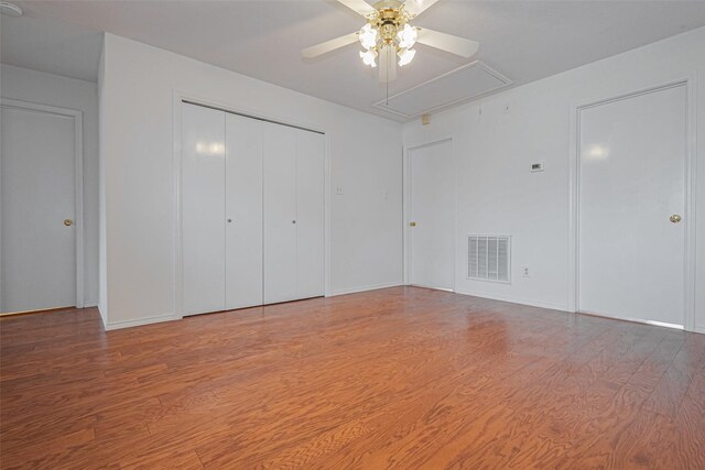 8223 Golf Green Cir, Houston, TX 77036 - unfurnished bedroom with attic access, wood finished floors, a closet, ceiling fan, and baseboards
