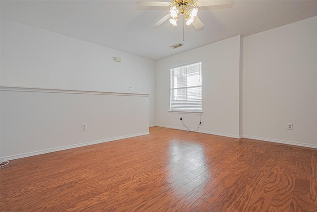 8223 Golf Green Cir, Houston, TX 77036 - unfurnished room with a ceiling fan, light wood-style floors, and baseboards