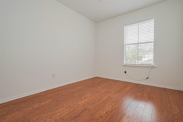 8223 Golf Green Cir, Houston, TX 77036 - spare room with light wood finished floors, baseboards, and lofted ceiling
