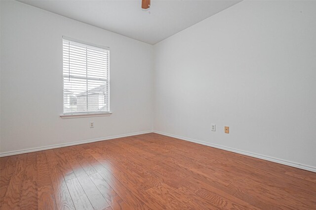 8223 Golf Green Cir, Houston, TX 77036 - unfurnished room with wood finished floors, baseboards, and a ceiling fan