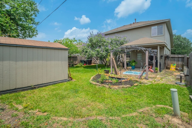 3911 Falvel Cove Dr, Spring, TX 77388 - view of yard featuring a pergola, a storage shed, an outdoor structure, and a patio